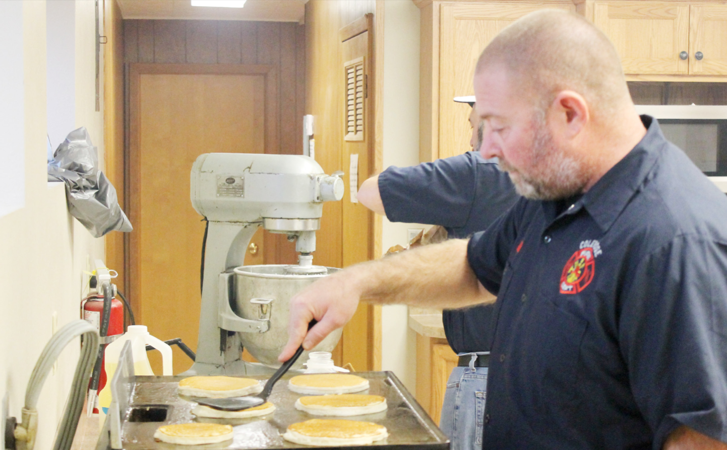Kelly Hammer, member of the Coleridge Volunteer Fire Department, makes pancakes at Sunday’s Fireman’s Breakfast