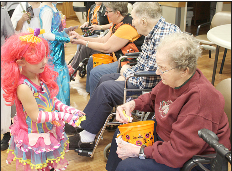 LaVern Acklie shares treats with trick-or-treater