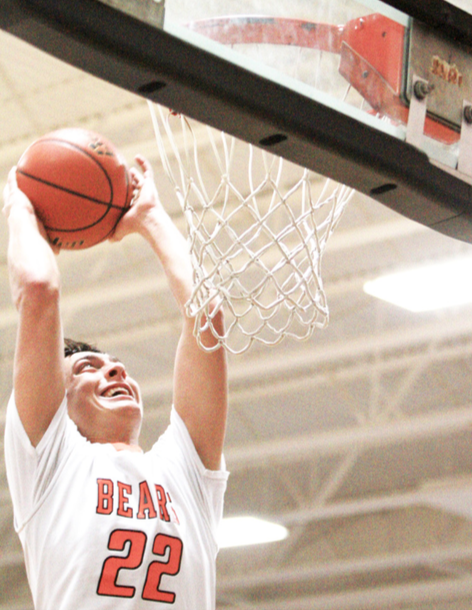 Noah Schutte goes up for a slam dunk for the LCC boys during Friday’s 69-23 home win over Emerson-Hubbard.