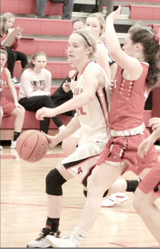 Randolph’s Cindy Haselhorst drives the ball past a defender and toward the basket during Holiday Tournament action here.