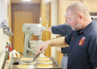 Kelly Hammer, member of the Coleridge Volunteer Fire Department, makes pancakes at Sunday’s Fireman’s Breakfast